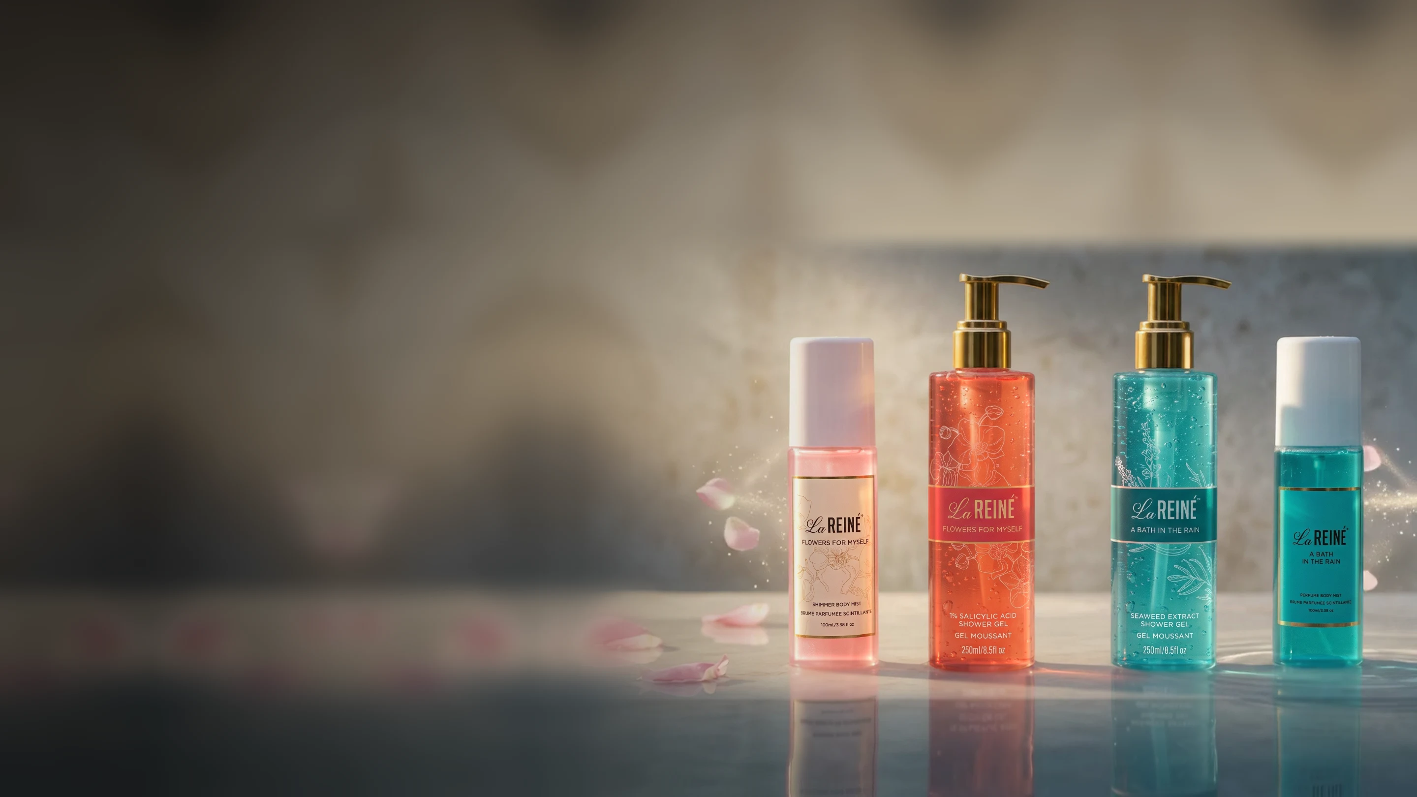 All four La Reiné bottles in a row on wet stone in warm morning light: Flowers for Myself shimmer mist and shower gel, A Bath in the Rain shower gel and shimmer mist